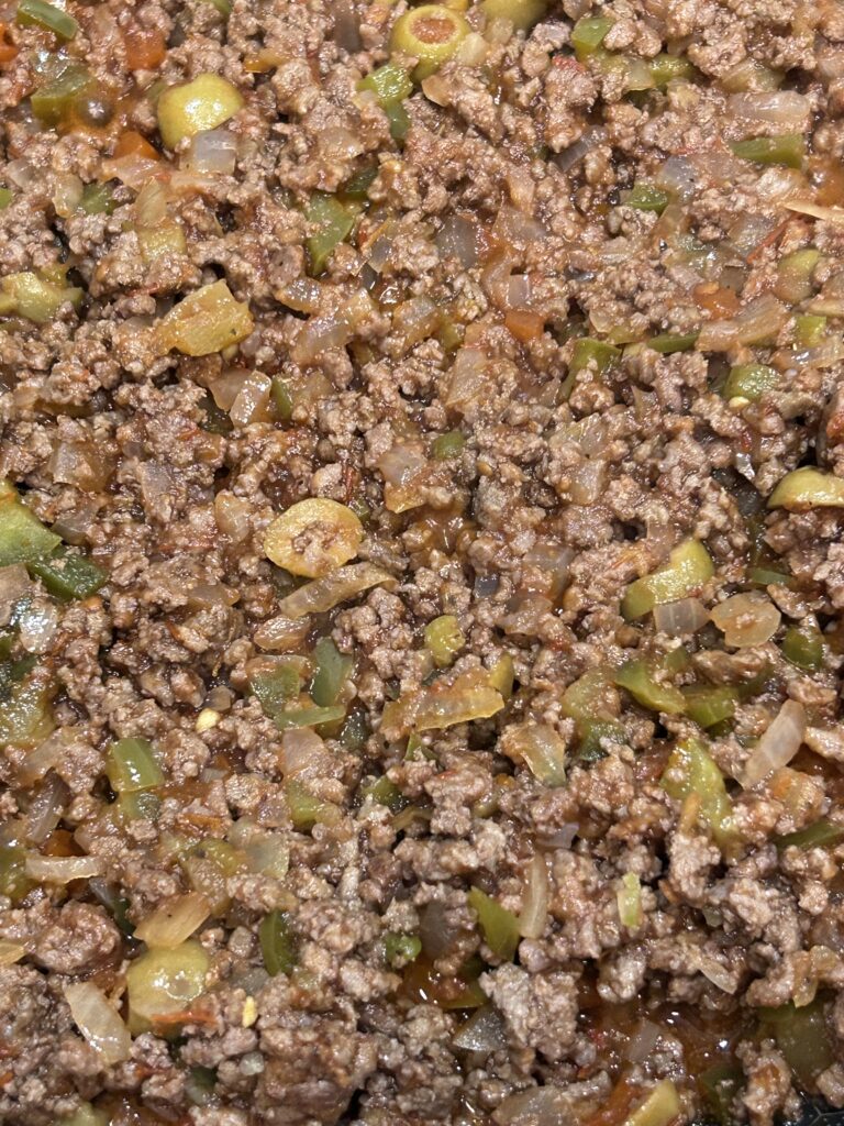 salsa, ground beef and veggies simmering in a aucepan. 