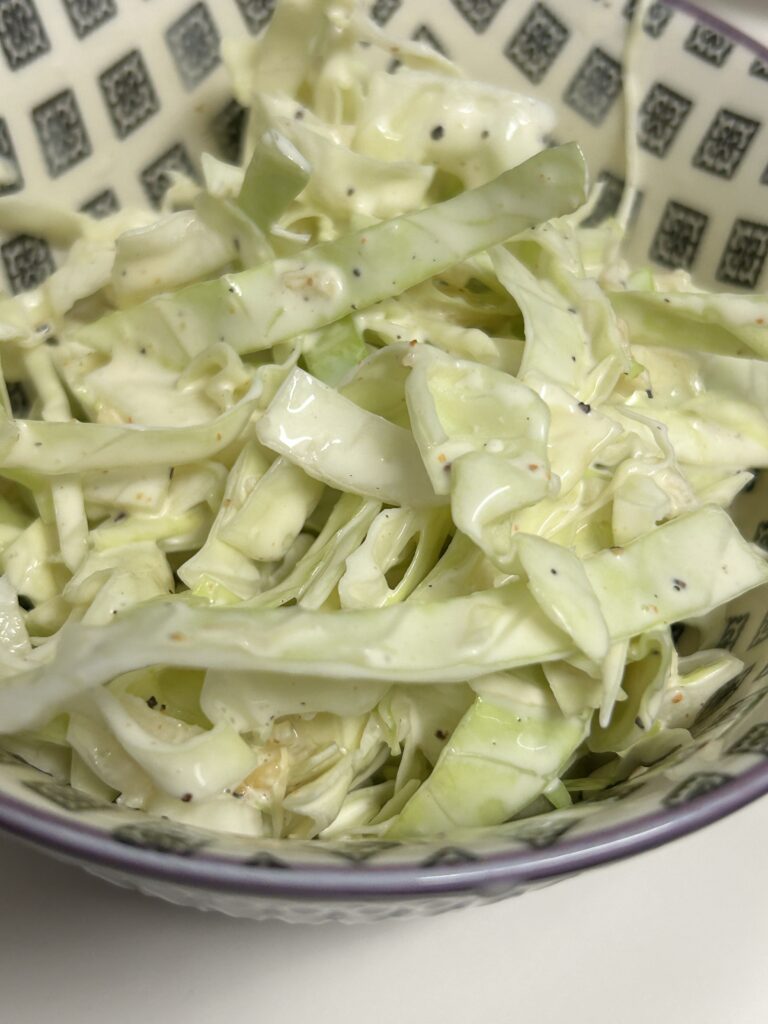 a serving of creamy coleslaw in a bowl.